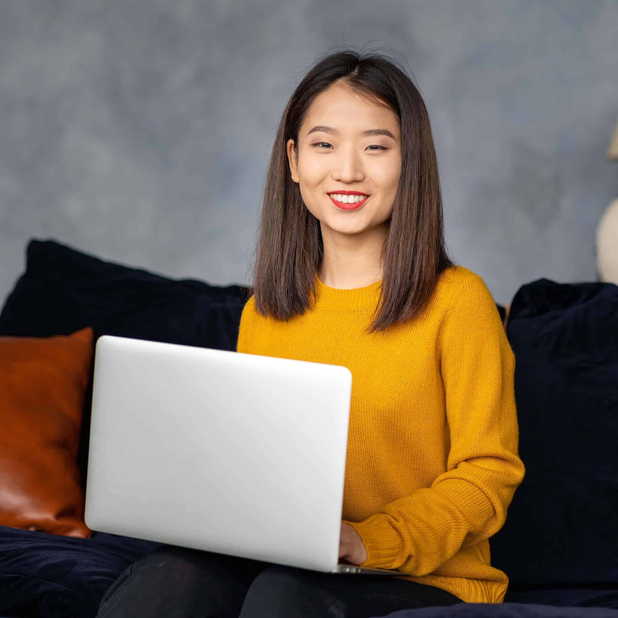 asian business woman working in laptop on sofa jap gm7yu66
