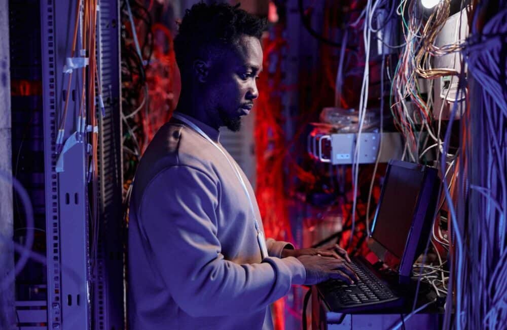 network-administrator-setting-up-servers-and-using